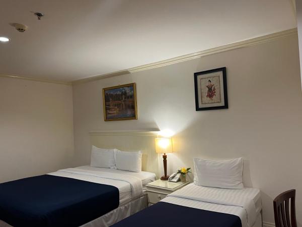 The Victory Residences Bangkok : photo 6 de la chambre chambre triple deluxe