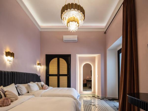 HOLT Hotel De Mi Independencia Double Queen Room : photo 2 de la chambre studio