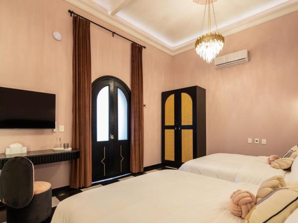 HOLT Hotel De Mi Independencia Double Queen Room : photo 3 de la chambre studio