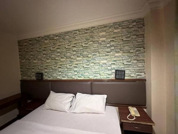 Lady Anne Hotel Sandkan : photo 1 de la chambre chambre lit king-size deluxe