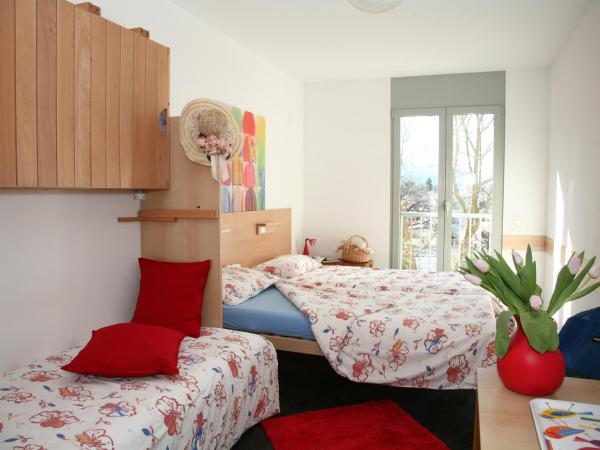 Lugano Savosa Youth Hostel : photo 1 de la chambre chambre quadruple Économique avec salle de bains commune