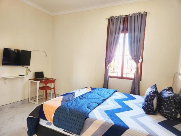 Surabaya Homey near UNAIR Syariah : photo 5 de la chambre chambre double