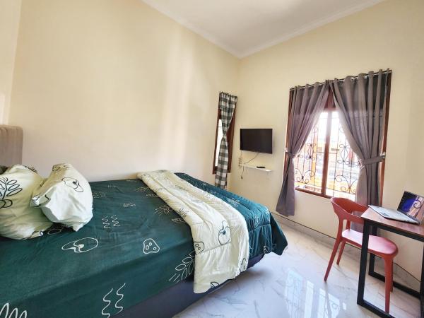 Surabaya Homey near UNAIR Syariah : photo 7 de la chambre chambre double