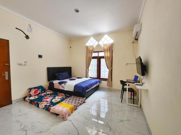 Surabaya Homey near UNAIR Syariah : photo 3 de la chambre chambre familiale deluxe