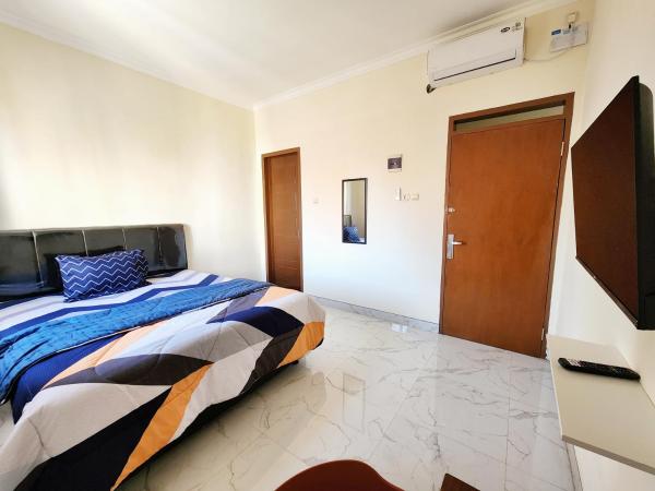 Surabaya Homey near UNAIR Syariah : photo 10 de la chambre chambre double