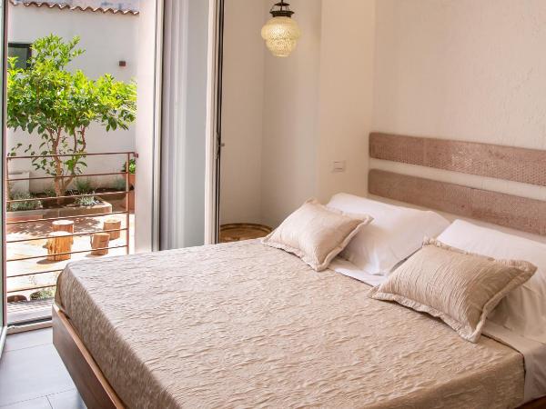 Amelia Apts & Rooms : photo 1 de la chambre chambre double - vue sur jardin