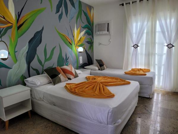 Pousada Costa Del Sol : photo 6 de la chambre chambre triple avec balcon