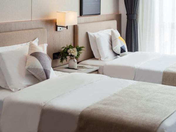 Livetour Hotel Shenzhou Road Metro Guangzhou : photo 4 de la chambre chambre lits jumeaux Élégante