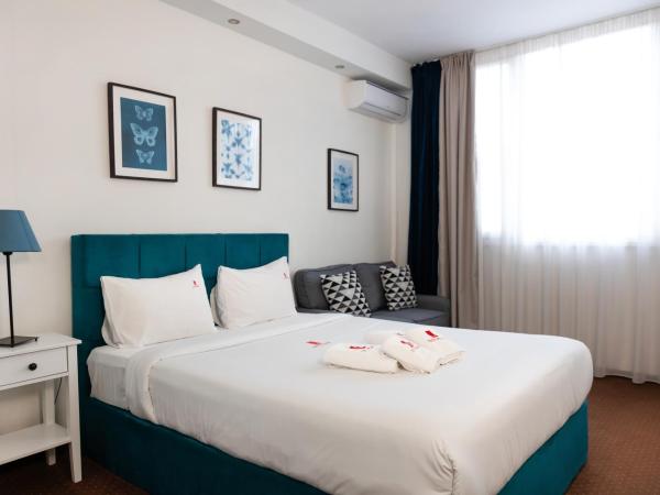 City Plaza Apartments & Rooms : photo 2 de la chambre chambre deluxe