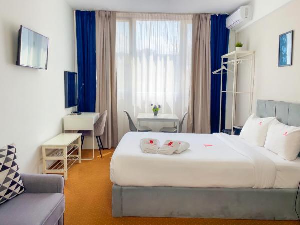 City Plaza Apartments & Rooms : photo 2 de la chambre chambre de luxe avec kitchenette