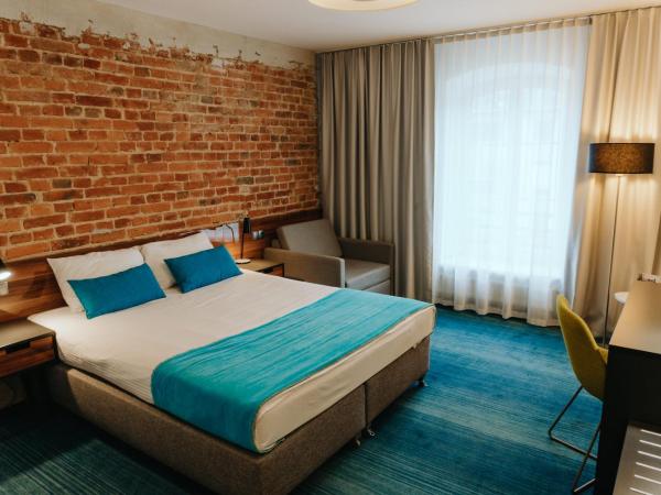 Hotel Tobaco Łódź : photo 3 de la chambre chambre double standard avec lit king-size