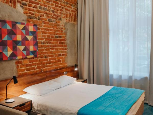 Hotel Tobaco Łódź : photo 2 de la chambre chambre double standard avec lit king-size