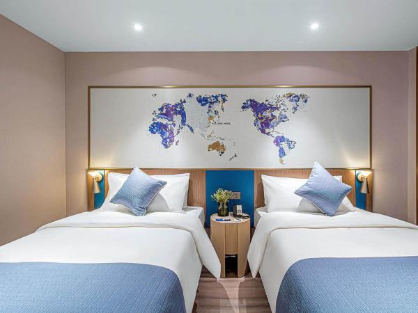 Kyriad Marvelous Hotel Wuxi Zhongshan Road Chong'an Temple : photo 1 de la chambre chambre lits jumeaux premium - vue sur ville