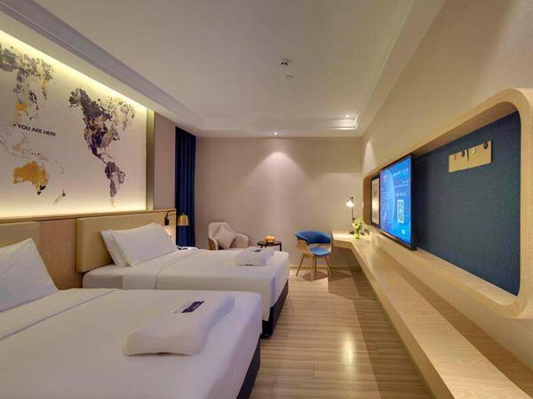 Kyriad Marvelous Hotel Guangzhou Baiyun International Airport : photo 2 de la chambre chambre lits jumeaux lumière