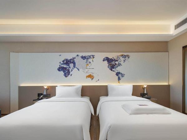 Kyriad Hotel Dongguan Houjie Convention and Exhibition Center Humen Station : photo 2 de la chambre chambre lits jumeaux deluxe