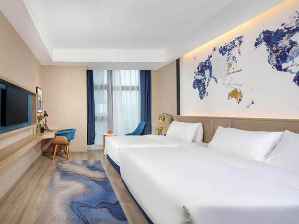 Kyriad Marvelous Hotel Chongqing North Railway Station : photo 1 de la chambre chambre familiale avec lits jumeaux