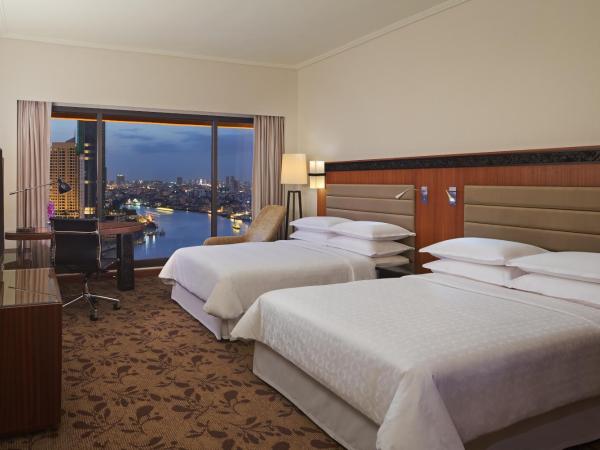 Royal Orchid Sheraton Hotel and Towers : photo 1 de la chambre chambre deluxe premium avec 2 lits doubles - vue sur rivière