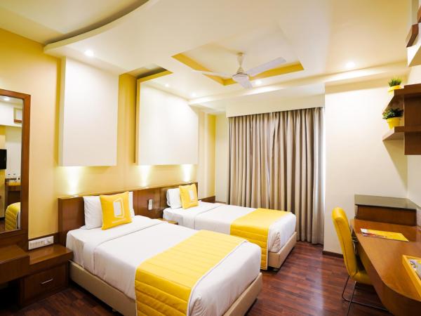 BloomSuites I Electronics City : photo 2 de la chambre chambre lits jumeaux deluxe