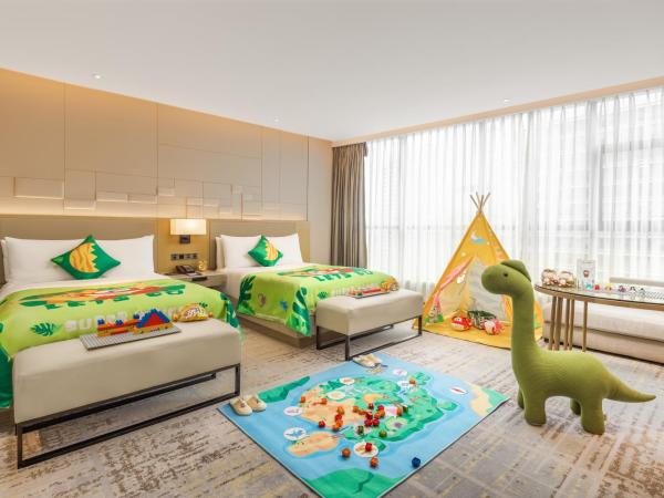 Chengdu Marriott Hotel Financial Centre : photo 3 de la chambre family room with two twin beds and twin towers view