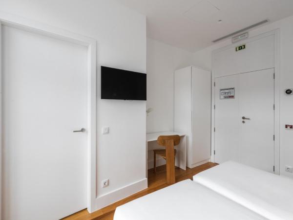 Avenida Viana Boutique Suites : photo 2 de la chambre chambre lits jumeaux avec balcon