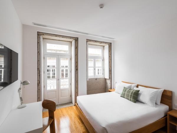 Avenida Viana Boutique Suites : photo 1 de la chambre chambre double avec balcon