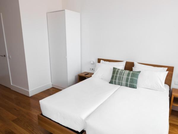 Avenida Viana Boutique Suites : photo 5 de la chambre chambre lits jumeaux supérieure