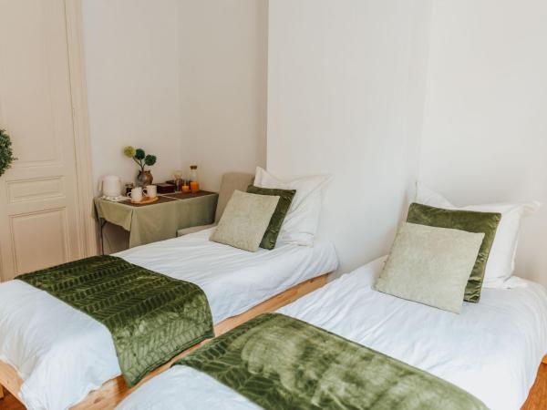 Ambiorix Residence : photo 1 de la chambre chambre double ou lits jumeaux avec salle de bains commune