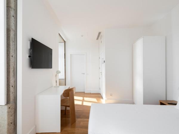 Avenida Viana Boutique Suites : photo 2 de la chambre chambre lits jumeaux