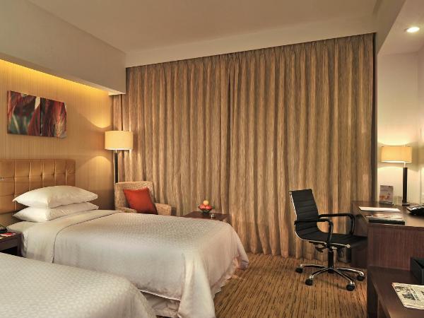 Four Points by Sheraton Hotel and Serviced Apartments Pune : photo 1 de la chambre deluxe room twin bed with city or pool view