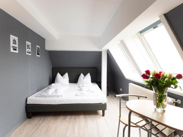 Hotel Astoria am Urachplatz : photo 1 de la chambre appartement