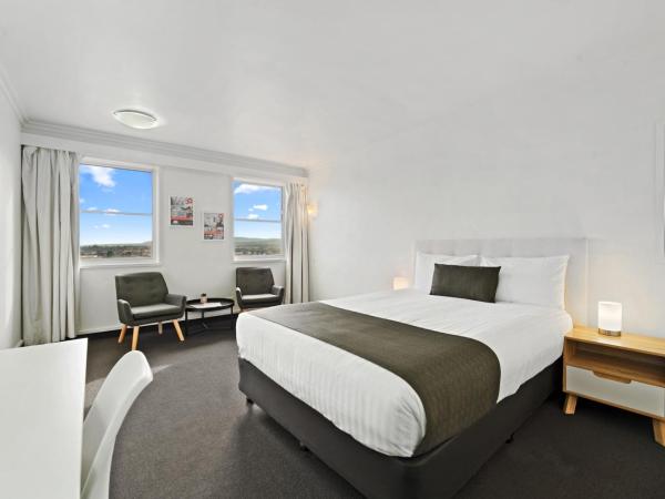 Coach House Launceston : photo 1 de la chambre chambre lit queen-size deluxe