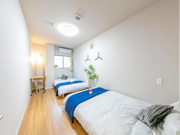 GUEST House彩 : photo 1 de la chambre chambre lits jumeaux avec salle de bains commune