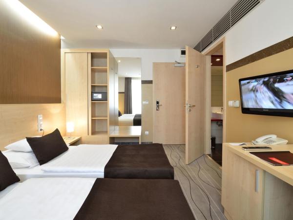 Promenade City Hotel : photo 6 de la chambre chambre double ou lits jumeaux