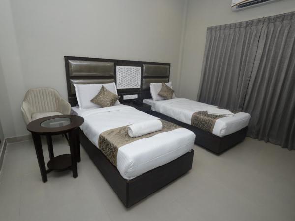 Grand Courtyard Business Hotel : photo 1 de la chambre chambre double ou lits jumeaux avec salle de bains