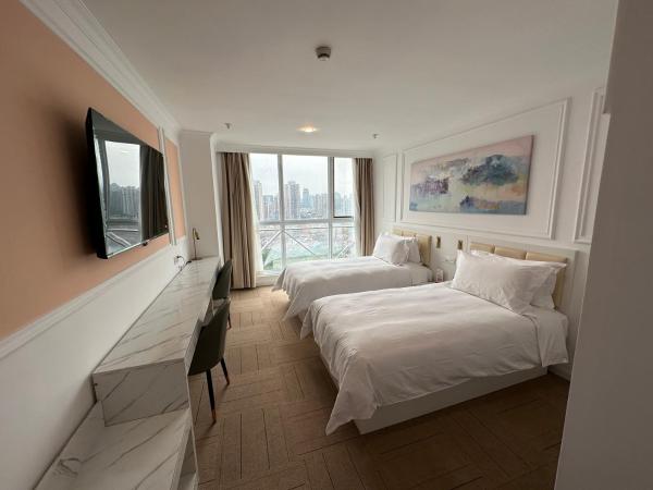 Magnificent International Hotel : photo 7 de la chambre chambre lits jumeaux deluxe