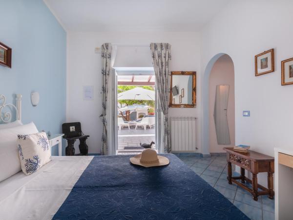 BnB Le Isole : photo 1 de la chambre chambre double ou lits jumeaux - vue sur jardin