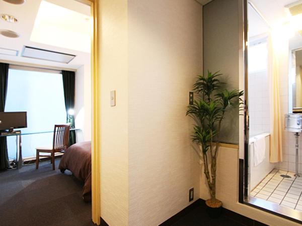 HOTEL LiVEMAX BUDGET Korakuen : photo 7 de la chambre chambre lits jumeaux de luxe - fumeurs