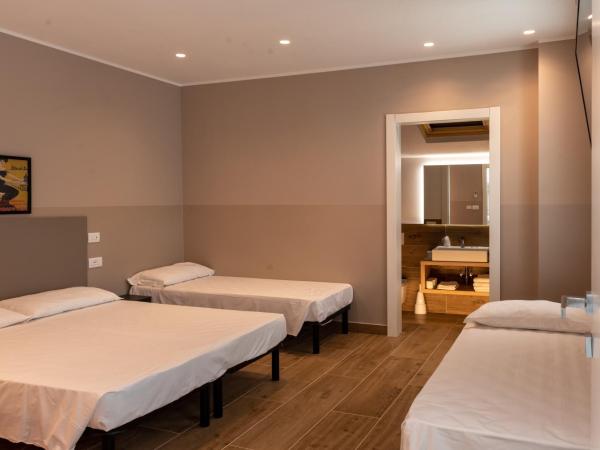 M14 RESIDENZA BASSANELLO : photo 1 de la chambre chambre familiale avec salle de bains privative