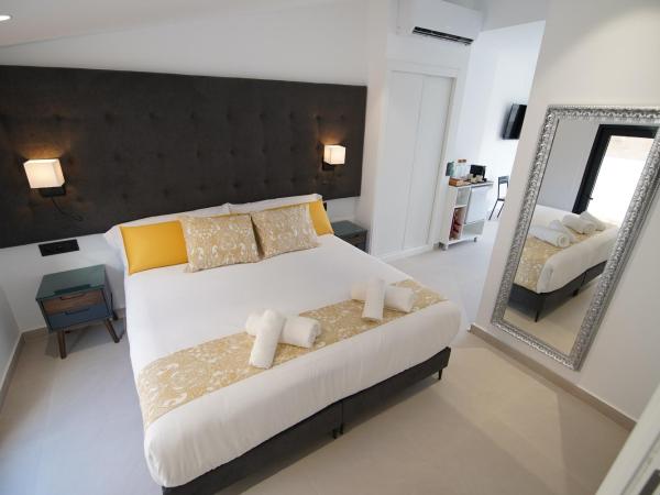Suites Puerto Valencia : photo 4 de la chambre suite supérieure lit king-size