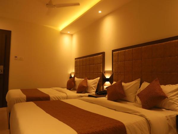 Hotel Sai Pritam : photo 1 de la chambre chambre quadruple avec salle de bains privative