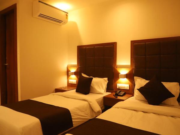 Hotel Sai Pritam : photo 2 de la chambre chambre lits jumeaux avec salle de bains privative