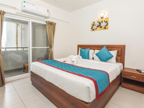 Suraksha Stay Whitefield Hotel : photo 9 de la chambre chambre familiale avec balcon