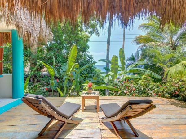 Casitas Maraika : photo 2 de la chambre chambre double ou lits jumeaux deluxe - vue sur mer