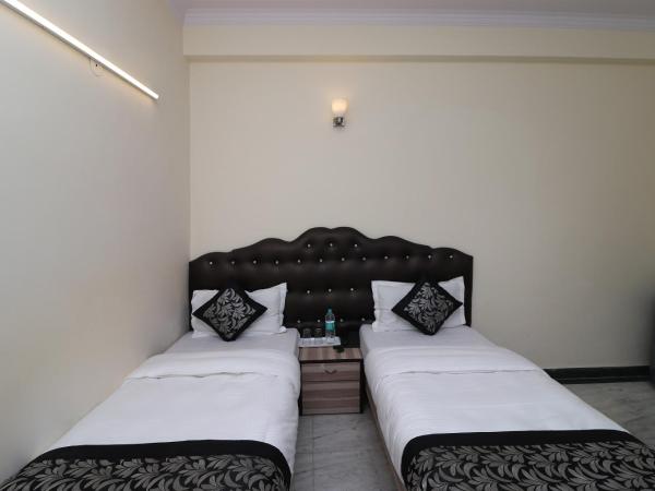 OYO Hotel Silver Shine Near Gurudwara Shri Bangla Sahib : photo 4 de la chambre chambre triple classique