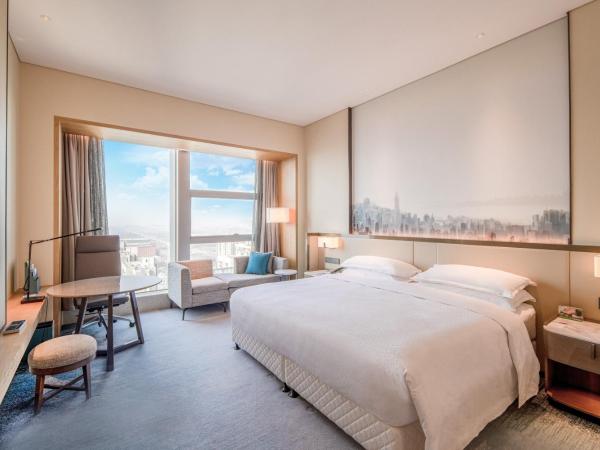 Four Points by Sheraton Wuhan, Jiangxia : photo 2 de la chambre chambre lit king-size deluxe - vue sur ville