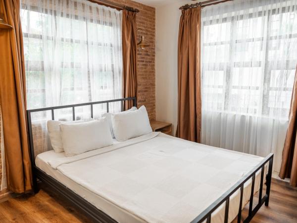 Blue Sea Garden : photo 3 de la chambre chambre lit king-size - vue sur jardin