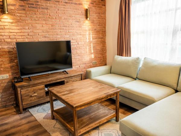 Blue Sea Garden : photo 4 de la chambre chambre lit king-size - vue sur jardin