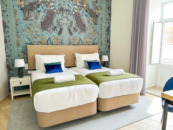 Guest House Jacarandá Faro : photo 2 de la chambre chambre lits jumeaux