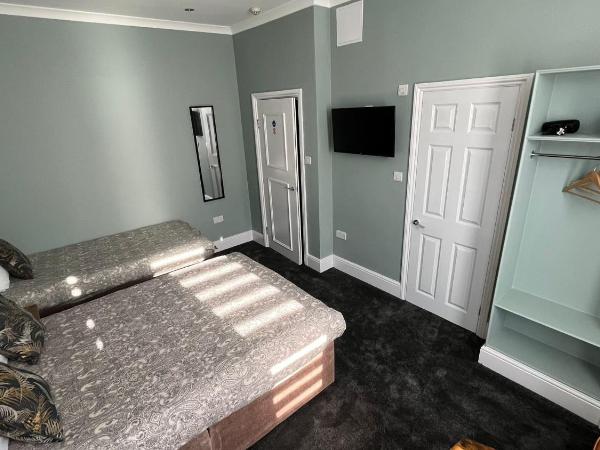 Charlotte Guest House : photo 5 de la chambre chambre triple