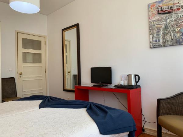 Discovery Apartment Benfica : photo 10 de la chambre chambre familiale